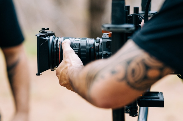Close up look of camera being held on set at Woodhill Forest
