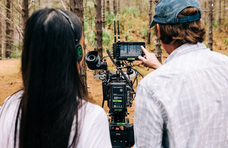 Cinematographer and driector review the shot while filming at Woodhill Forest