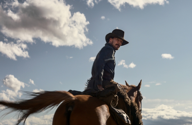 Benedict Cumberbatch on a horse in Power of the Dog film 