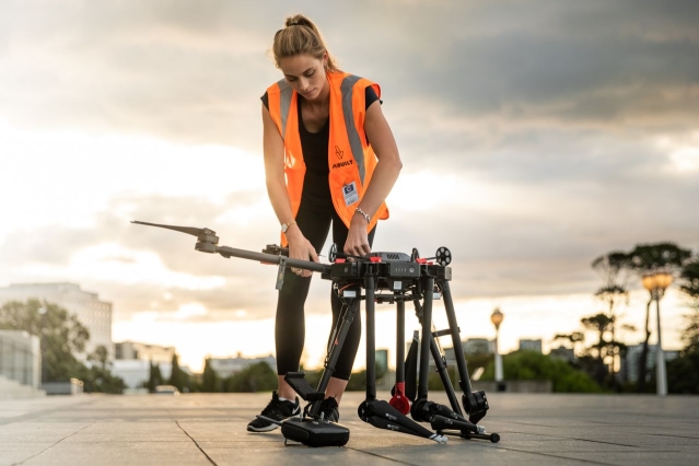 woman-setting-up-drone